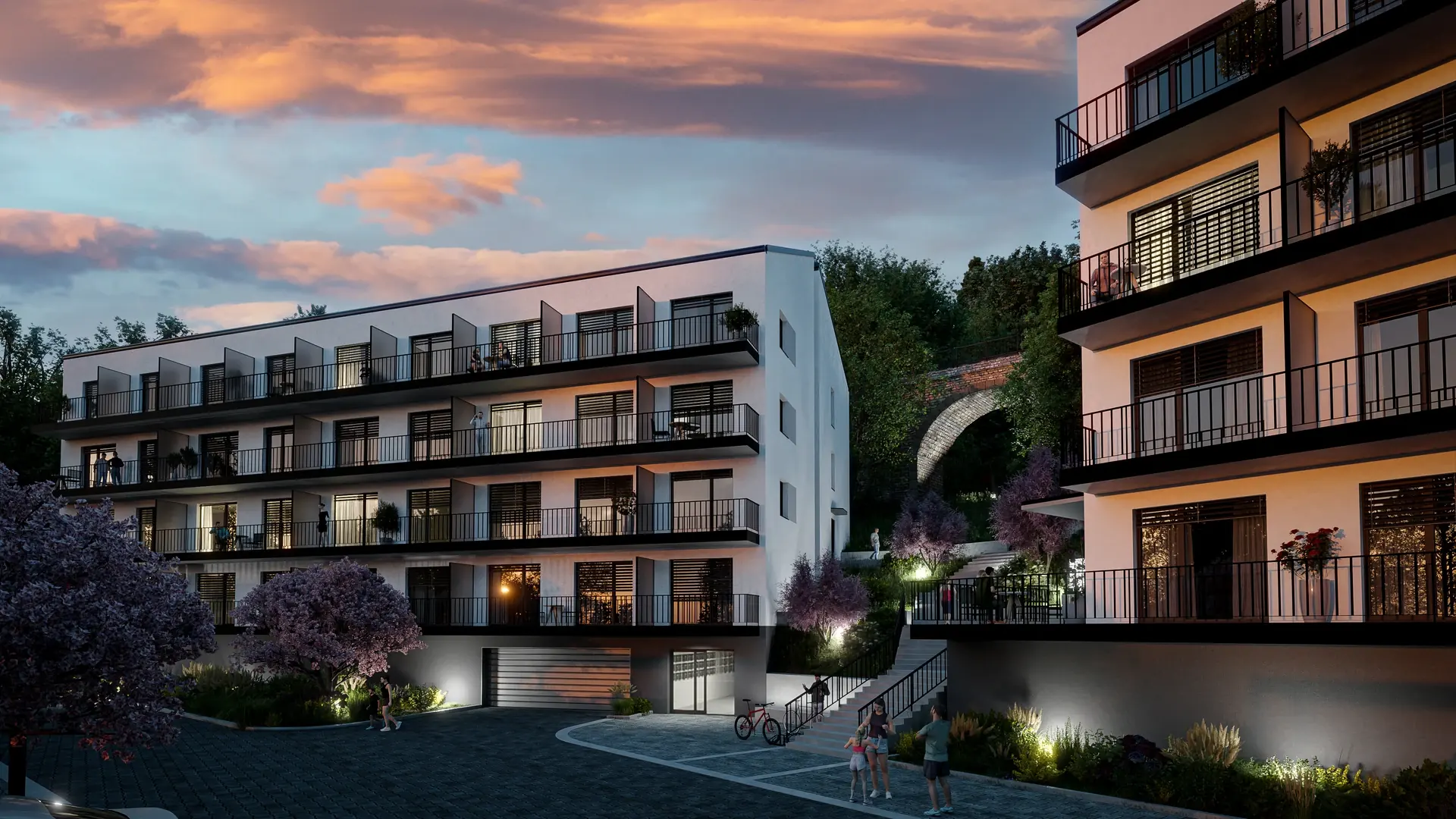 DUO Hlubočepy — evening view of the buildings and courtyard